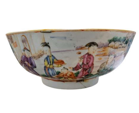 An 18th century Chinese Export porcelain circular punch bowl, painted in colourful polychrome with a family enjoying the frui