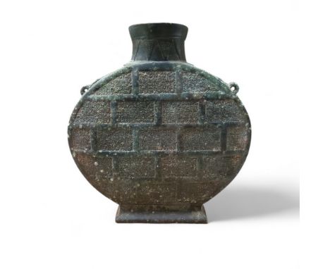 A Chinese archaic bronze 'moonflask' or Bianchu, possibly Warring States Period, each flattened side raised on a spreading re