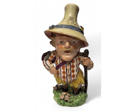 An 18th century&nbsp; Derby Mansion Dwarf, modelled in flamboyant 17th century cavalier costume with long moustache and tall 