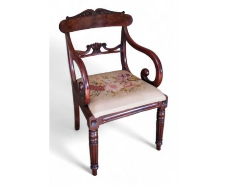 A Regency mahogany elbow chair, scroll cresting, drop in tapestry seat, fluted legs, c.1815