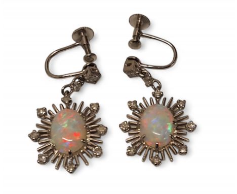 A pair of 9ct white gold, crystal opal and diamond drop sunburst earrings, central claw set crystal opal, 11 x 7mm, bordered 