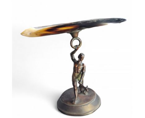 An early 20th century novelty figural tazza, mother-of-pearl shell top, warrior stand, circular base, 19cm high, c.1900