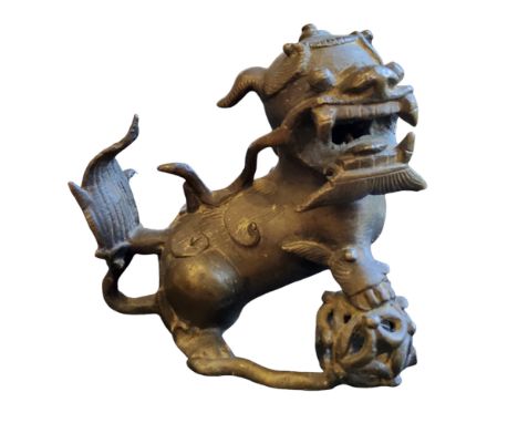Chinese School, 19th century, a gilt patinated bronze, of a temple guardian lion, 12cm high