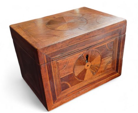 A 19th century parquetry tea caddy, inlaid with roundels, the interior with two compartments, 12cm high, 18cm wide, c.1870