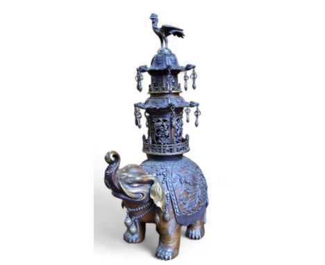 A monumental Japanese Meiji period (1868-1912) parcel-gilt bronze incense burner / koro, the finely cast elephant standing fo