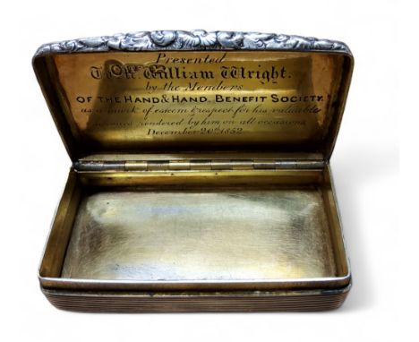 A William IV silver round rectangular snuff box, engine turned in bands, rectangular cartouche, foliate thumb piece, gilt int