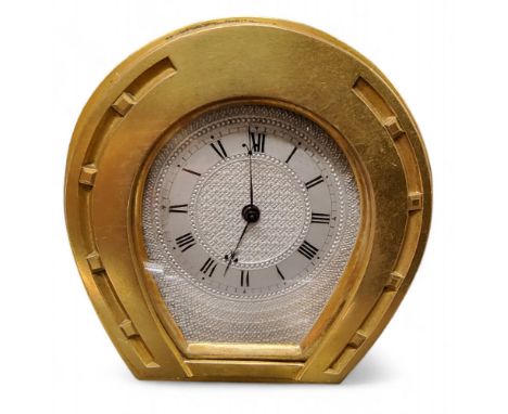 An English ormolu horseshoe clock, in the manner of Thomas Cole, the silvered engine turned dial with Roman numerals, steel h