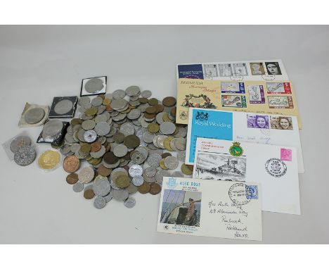 A collection of foreign coinage commemorative crowns and first day covers
