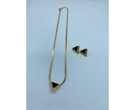 A Christian Dior necklace and earring set.