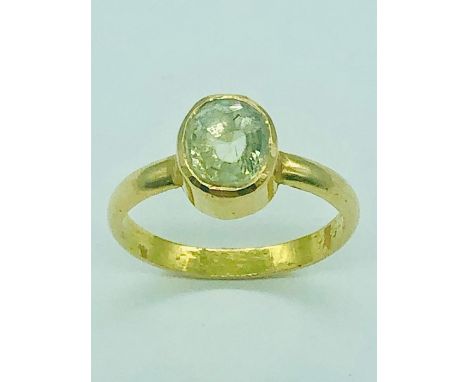 A 22ct yellow gold ring with central stone (5.1g)