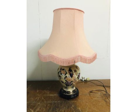 A Chinese vase lamp base with pink fringed lamp shade 