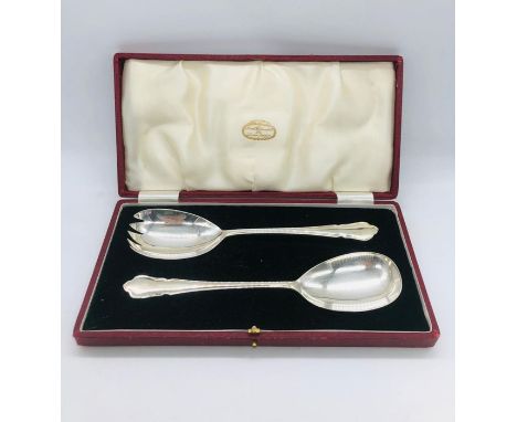 A boxed set of silver plated serving spoons from James Walker Ltd.