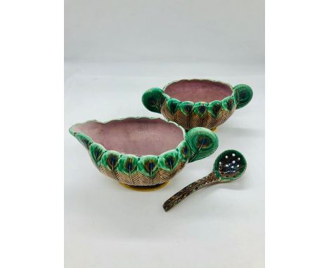 A pair of rare Wedgwood Majolica peacock design sauce boats, one with ladle.