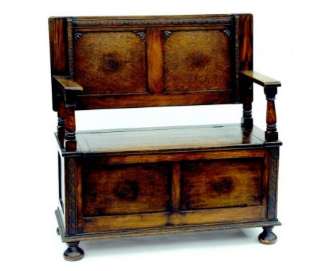 AN OAK MONKS BENCH, CIRCA 1920