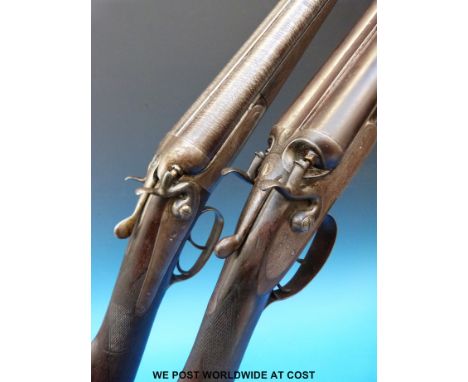 An unmatched pair of Joseph Lang & Sons side by side hammer action shotguns, one with ornate scrolling engraving, the other w