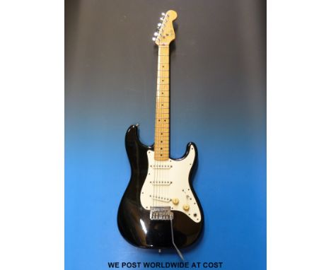 An 1983 Fender Stratocaster electric guitar in case, serial no E316912, with receipt dated 1988 from R & B Music and case