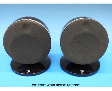 A pair of Focal Dome compact speakers with stands.