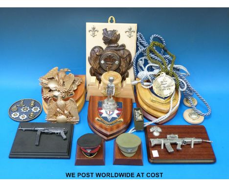 A quantity of military plaques to include Scots Guards, Household Cavalry etc, mounted miniature caps, Grenadier Guards model