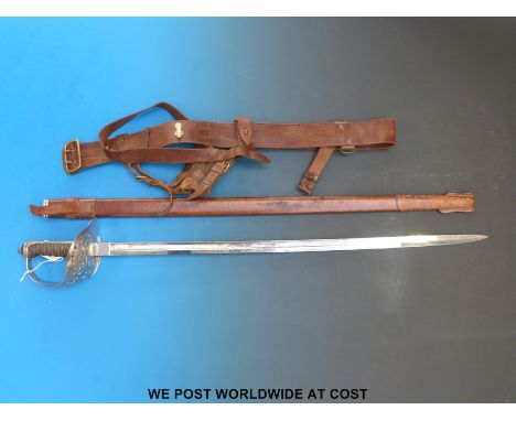 An 1895 pattern sword with replacement blade, in leather scabbard.