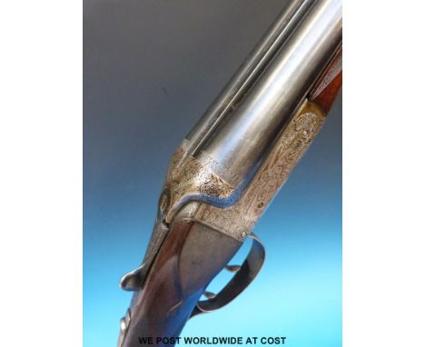 Midland Gun Company side by side shotgun with all over engraved decoration featuring scenes of dogs and pheasants, double tri