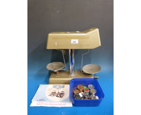 A vintage Moneychecker weighing machine/scales with weights and instructions