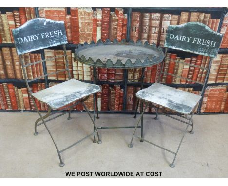 Two folding vintage 'Diary Fresh' chairs and galleried table 