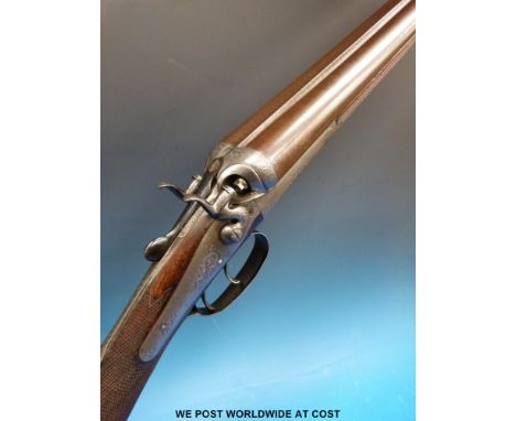 E M Reilly & Co 12 bore double barelled side by side hammer action shotgun with ornate engraving to the locks and dolphin ham