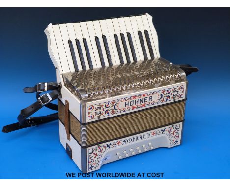 A Hohner Student II 12 bass piano accordion in ivory finish with red blue and gold decoration, c1930's, with new leather stra