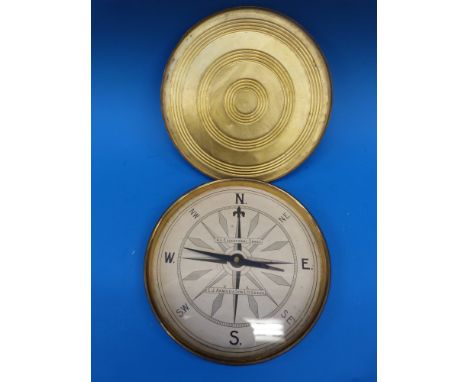 A gilt cased E.J. Arnold & Sons, Leeds, educational compass, 21 cm in diameter.
