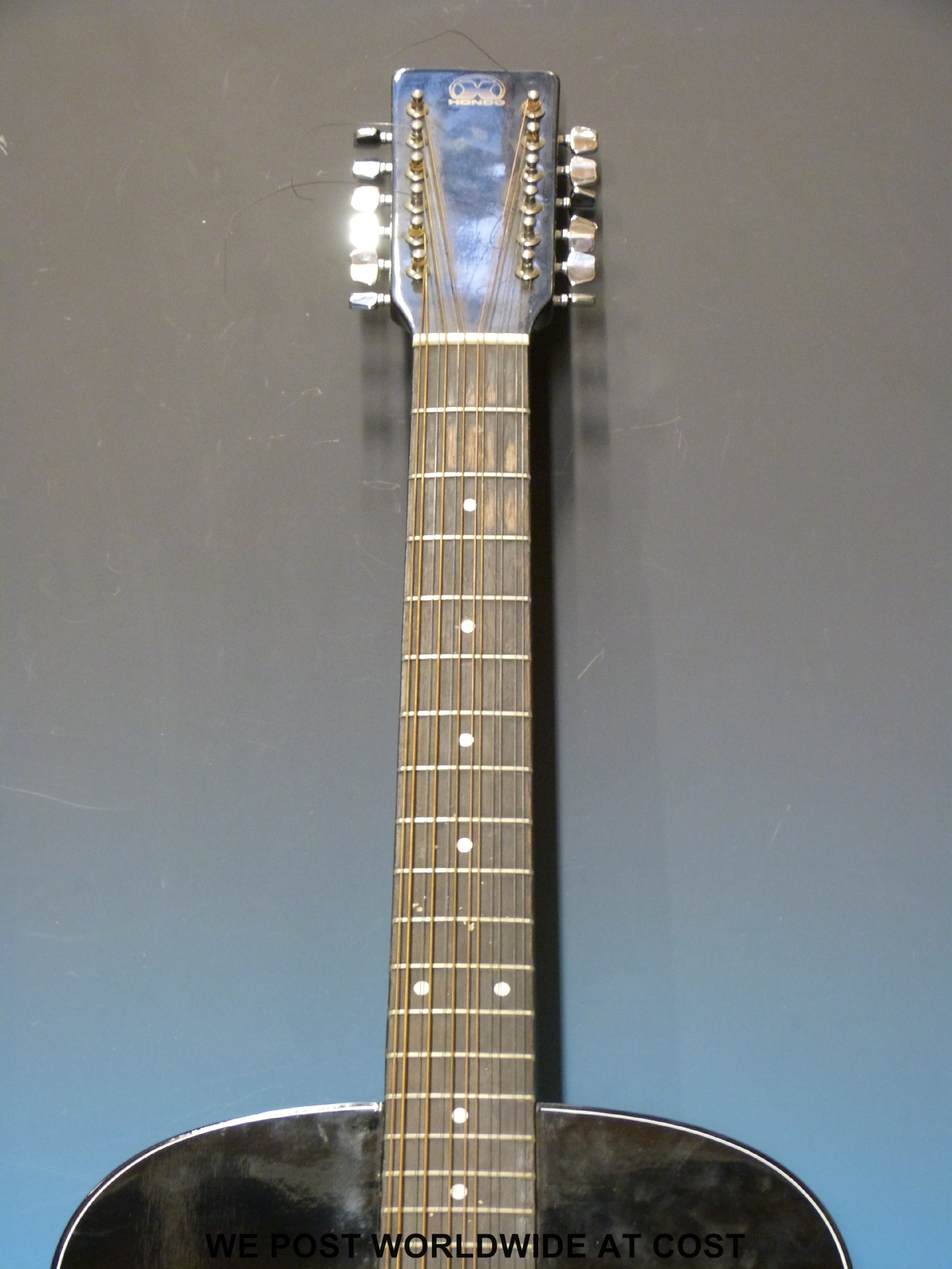 Hondo model H12412B 12string acoustic guitar in black laquered finish with soft case