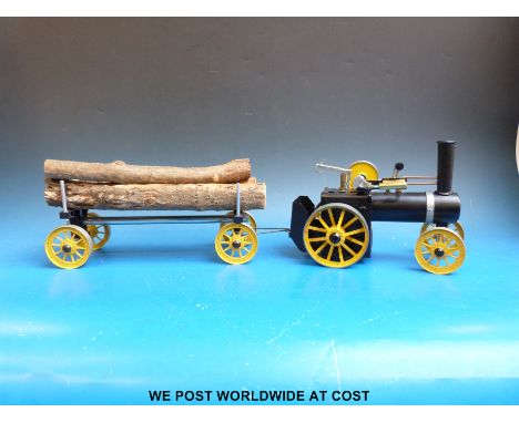 A Mamod TWK1 live steam traction engine assembled from a kit of parts with log wagon and original assembly/ running instructi