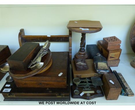 A book trough, a pedestal stand, treen boxes, Elkington canteen and cutlery, cut throat razors, GPO scales, metal hand letter