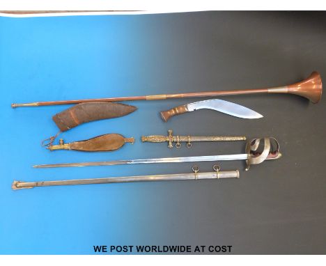 A WW2 Italian cavalry officers sword together with a decorative dagger, kukri, suede shot flask and copper hunting horn. 