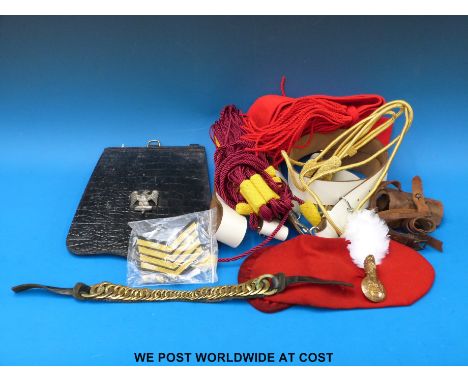 A quantity of millitary items including lanyards white leather dress belts, sash, buttons, stripes, Royal Artillery badge and