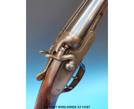 Midland Gun Company 12 bore side by side hammer action shotgun with chequered semi-pistol grip, vacant cartouche to stock and