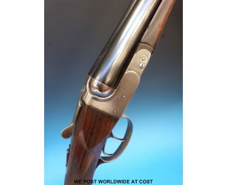 BSA 12-bore side-by-side shotgun with chequered semi-pistol grip and 28" barrels, named to rib 'made by BSA Guns, England'. O