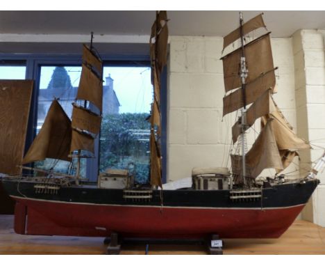 A scratch-built model sailing ship based on the Cutty Sark, last sailed for 12 miles across Caernaervon Bay in 1969 with note