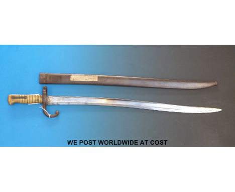 A French 1874 pattern engraved bayonet in metal scabbard 