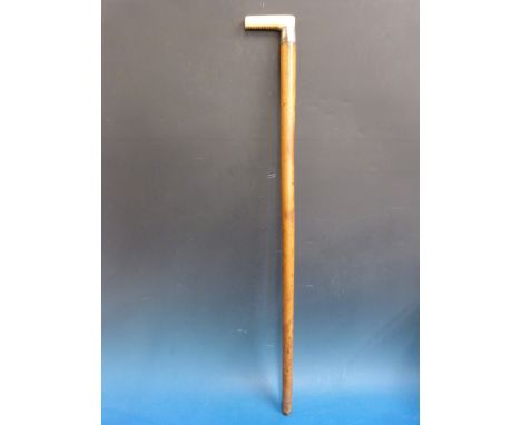 A marine ivory-handled walking stick with white metal collar marked "Dublin" with malacca shaft