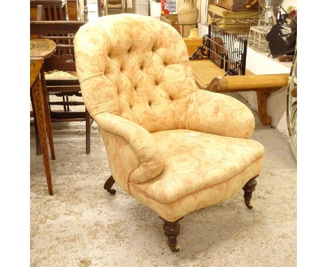 A Victorian button-back upholstered armchair 