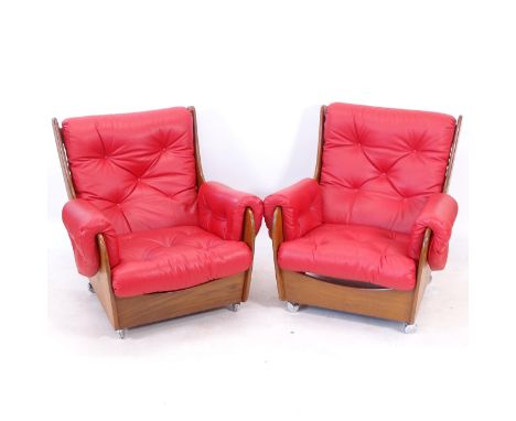 A pair of mid-century G Plan saddle-back armchairs, re-upholstered in button-back red leather 