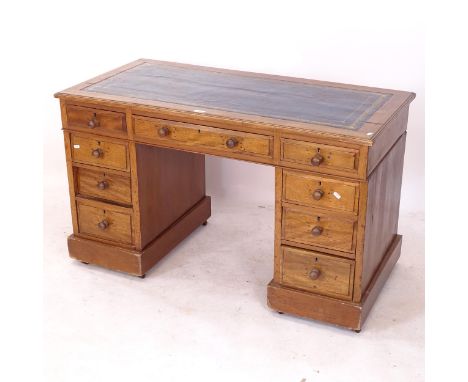 An Edwardian mahogany twin-pedestal writing desk, with fitted drawers, W121cm, H71cm, D61cm, kneehole width 52cm and height 5