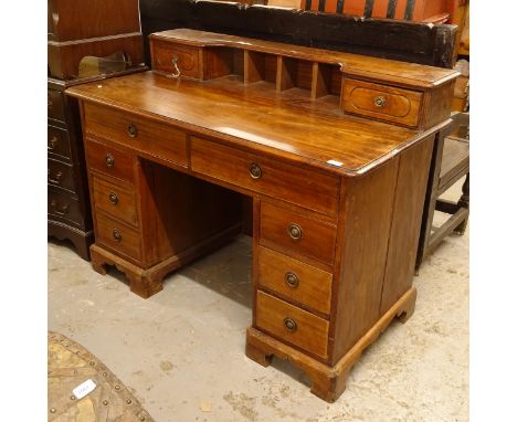 An Antique mahogany kneehole writing desk, with 8 fitted drawers, W122cm, H92cm, D96cm 