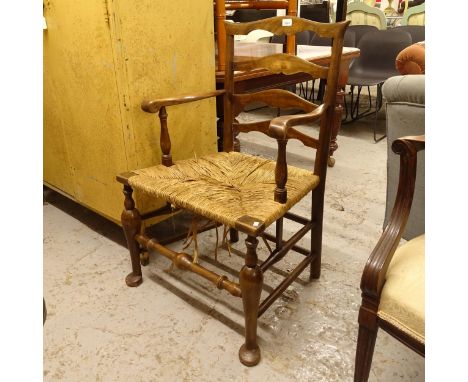 A 19th century Chippendale armchair with rush seat 