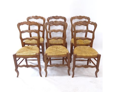 A set of 6 French oak ladder-back and rush-seated dining chairs 