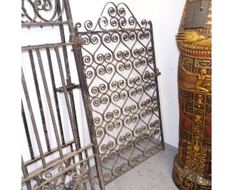 A decorative scrolled wrought-iron side gate, width including hinge mount 91cm, H152cm 