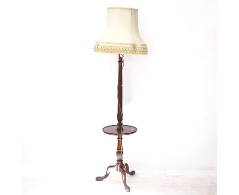 An Edwardian mahogany standard lamp and shade, with integral shelf, on tripod base, overall height 177cm 