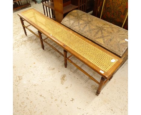 A Victorian mahogany and cane-panelled bench, on 8 turned legs, L184cm, H45cm, D33cm 