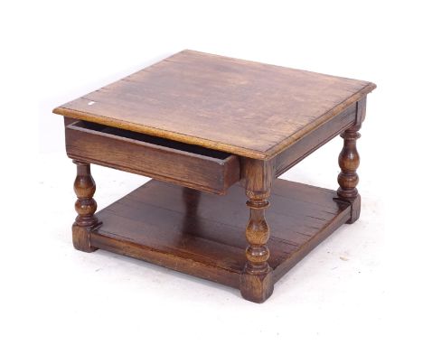 A Titchmarsh & Goodwin joined oak 2-tier lamp table, with single frieze drawer, on baluster turned legs, label to the inside 