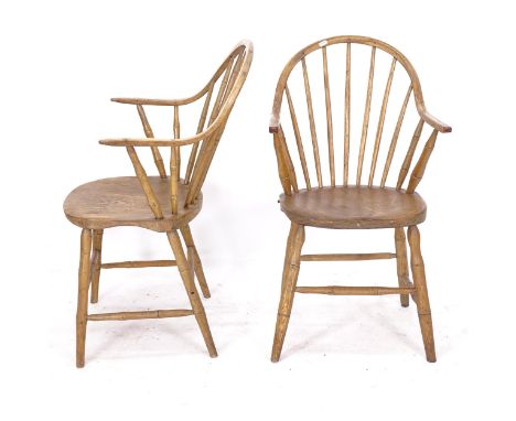 A pair of elm-seated stick-back elbow chairs 